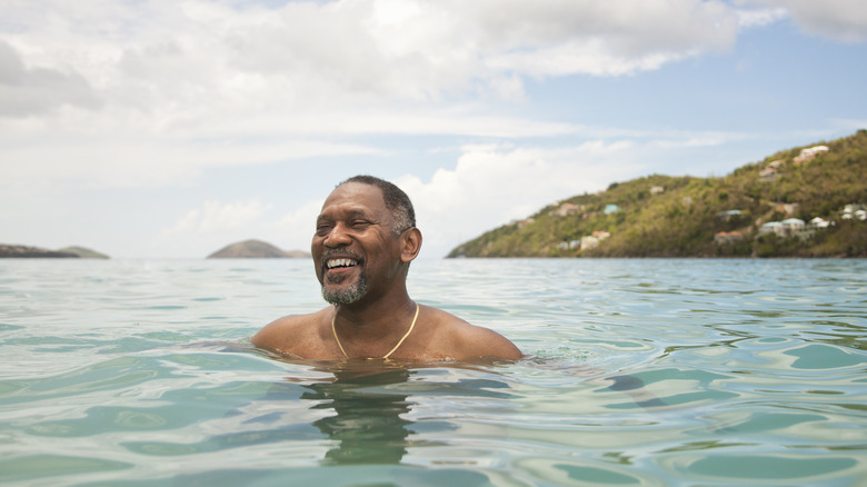 older man swimming in the sea